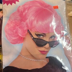 Adult pink lady wig. New in pkg. Still in packing so it wont be knotted up. 50’s